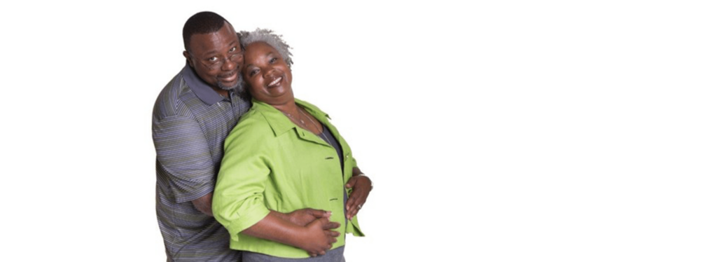 Black couple lovingly hugging