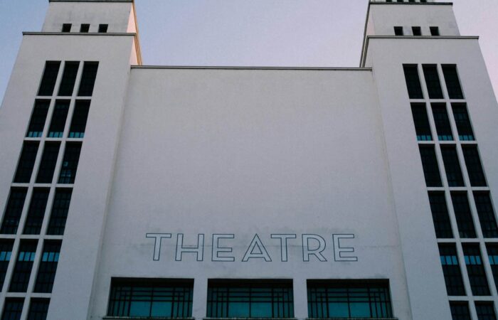 Photo of a white theatre facade.