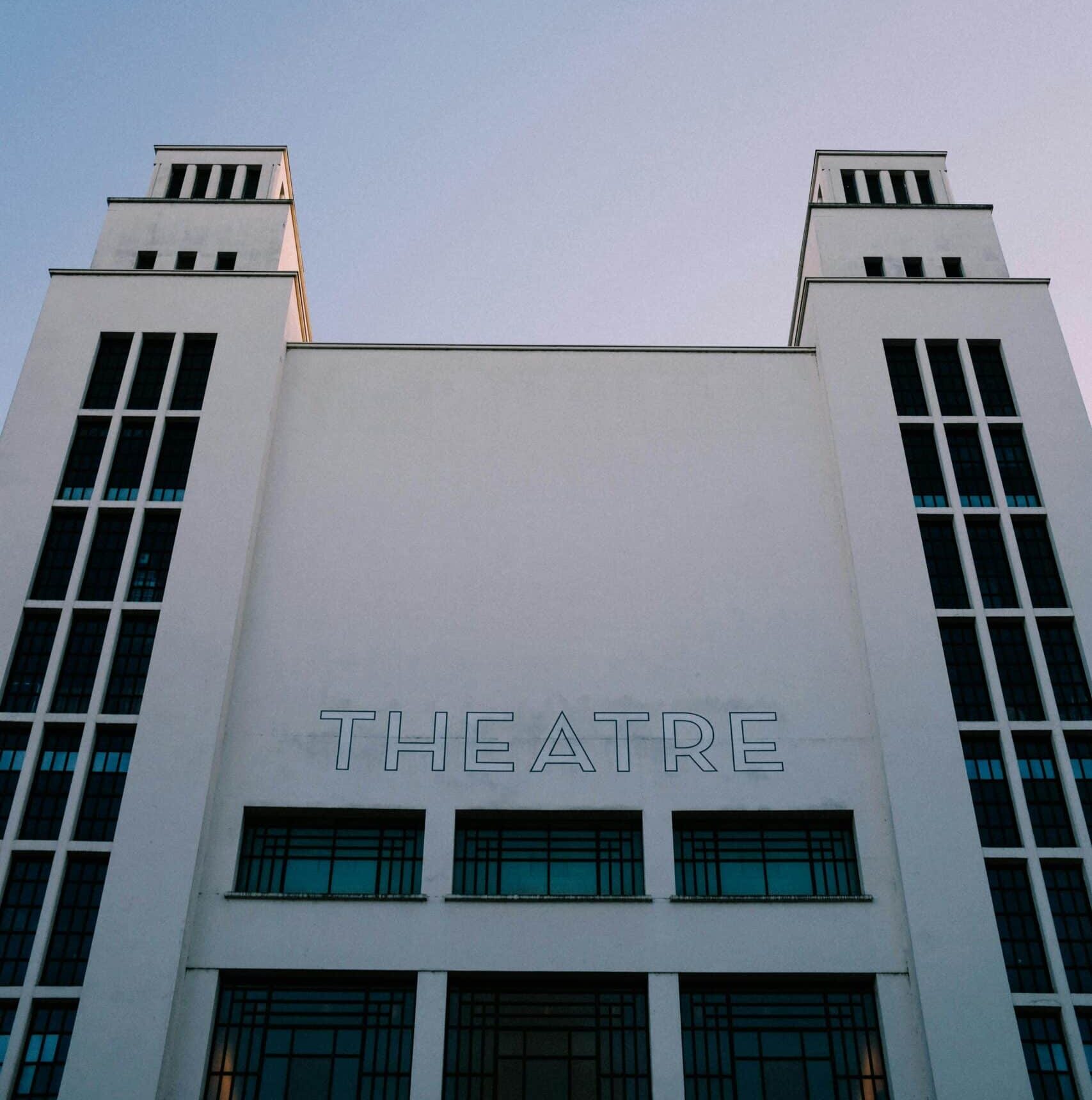 Photo of a white theatre facade.