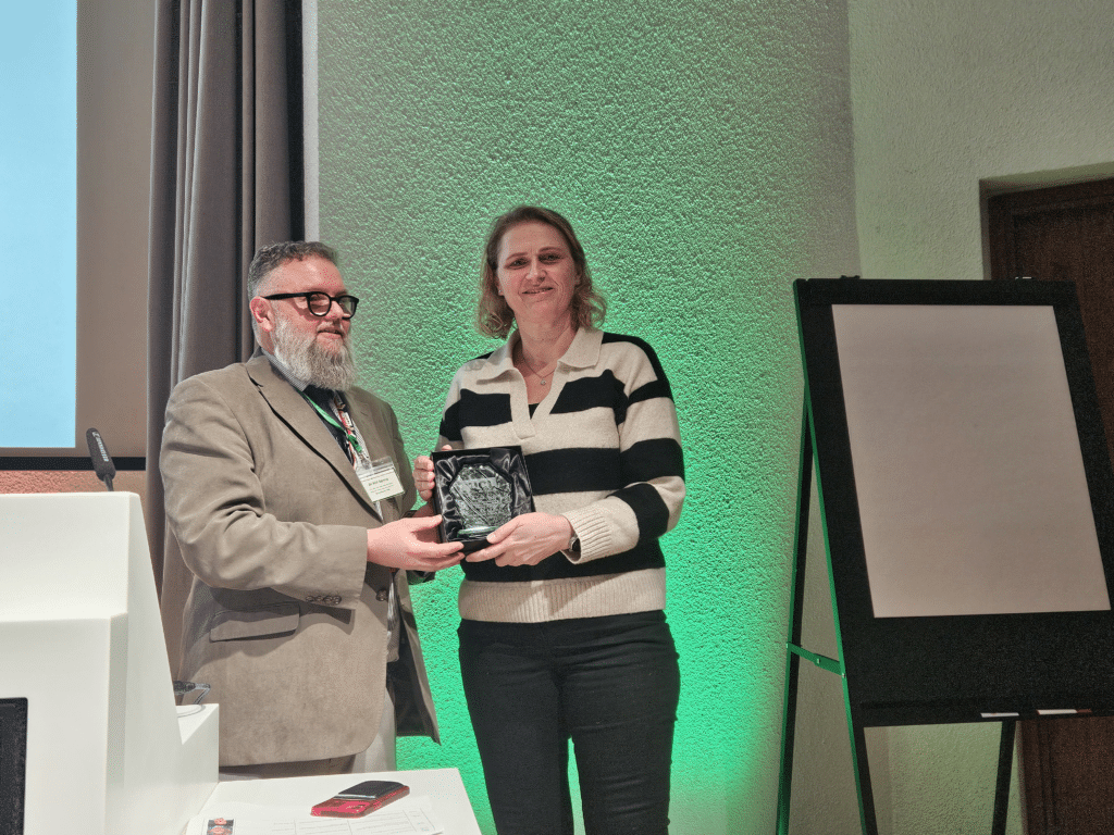 Torps Boukens, Islington Carers Hub's Team Leader, receiving the Outstanding Participation of a Community Service in Teaching UCL Medical Students award